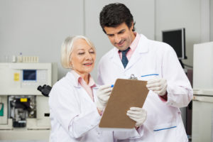 scientists looking at a clipboard